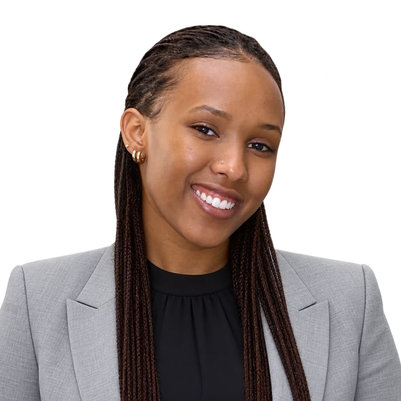 An anka partner wearing a light grey business blazer.